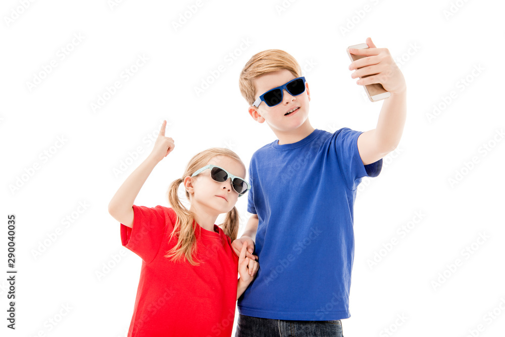 two kids in sunglasses taking selfie isolated on white two kids in sunglasses taking selfie isolated on white