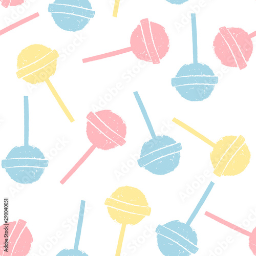 Colorful pastel lollipops on white background in flat style. Seamless background with cute candy. © jullyromas