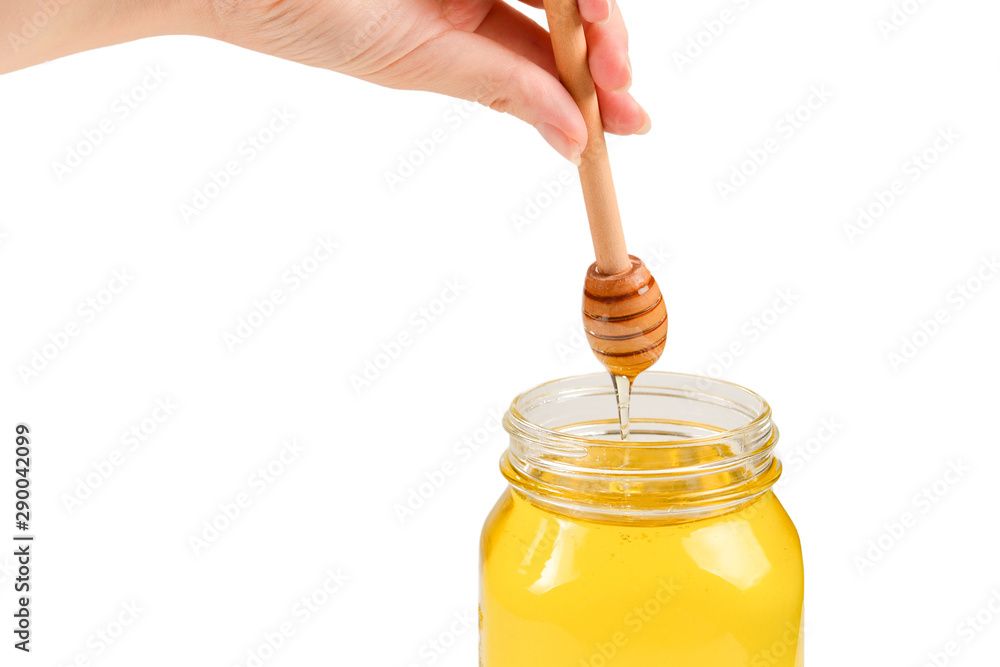 Dipper with honey in woman hand. Space for text or design. Dipper with honey in woman hand. Space for text or design.