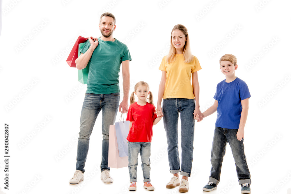 full length view of smiling family with shopping bags isolated on white