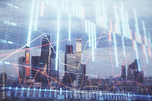 Multi exposure of financial chart on Moscow city downtown background. Concept of stock market analysis