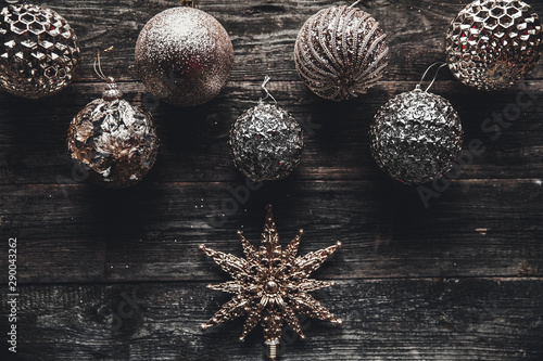 Christmas or New Year background. Vintage Christmas tree toy decoration balls over rustic wooden background, selective focus, copy space