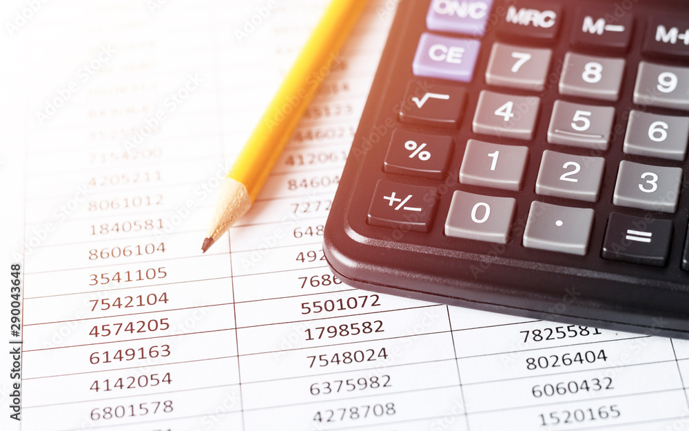 Calculator with pencil on white paper with numbers. Business and Finance accounting concept. Calculator with pencil on white paper with numbers. Business and Finance accounting concept.