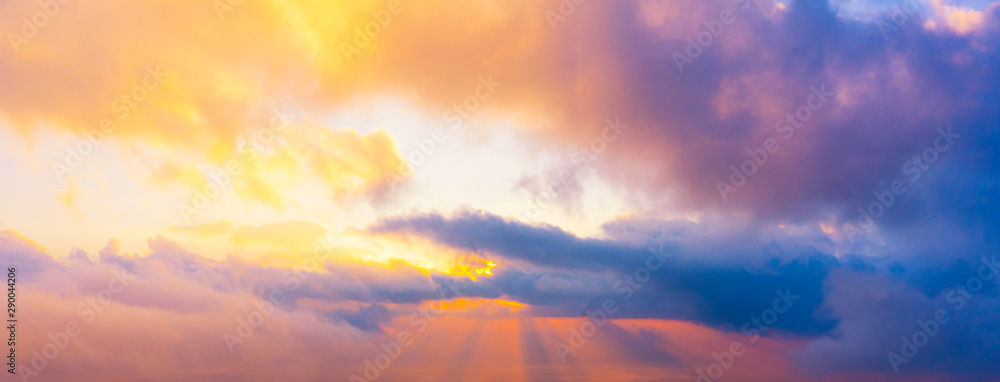 Scenic view of colorful sky with golden sunray