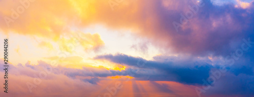 Scenic view of colorful sky with golden sunray