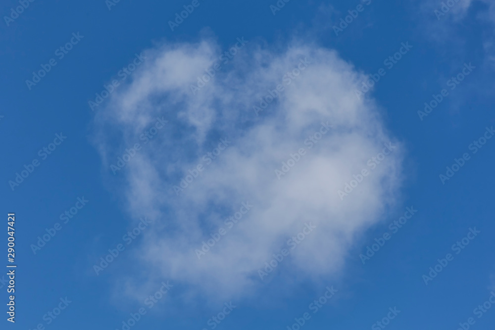 Background of a one single cumulus cloud with a blue clear sky Background of a one single cumulus cloud with a blue clear sky