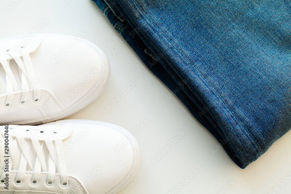 Jeans and sneakers on the store shelf. Jeans and sneakers on the store shelf.