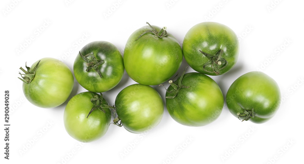 Green unripe tomatoes isolated on white background, top view