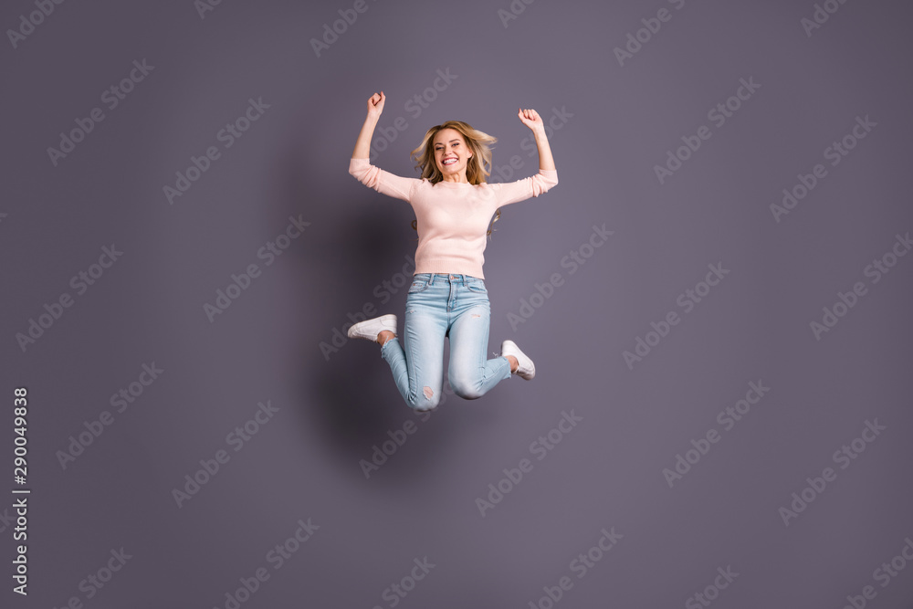 Fototapeta premium Full size photo of pretty lady jumping high competitive mood cheerleading wear casual stylish outfit isolated grey color background