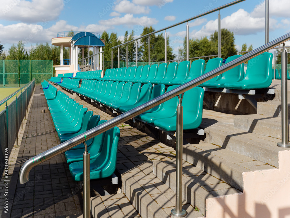 stands with seats of a small stadium stands with seats of a small stadium