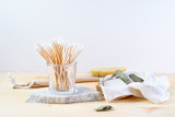Zero waste supplies for personal hygiene: bamboo q-tips, eco soap, wooden cactus brush. Plastic free concept.
