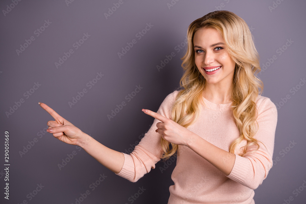 Portrait of her she nice-looking attractive lovely cheerful cheery glad confident wavy-haired girl pointing two forefingers aside copy space ad decision isolated over gray pastel color background Portrait of her she nice-looking attractive lovely cheerful cheery glad confident wavy-haired girl pointing two forefingers aside copy space ad decision isolated over gray pastel color background