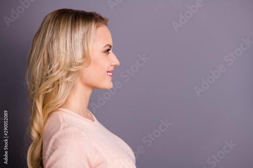 Close-up profile side view portrait of her she nice-looking attractive shine lovely lovable winsome content cheerful cheery wavy-haired girl isolated over gray pastel color background