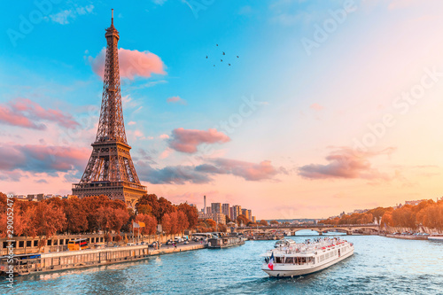 Fototapeta The main attraction of Paris and all of Europe is the Eiffel tower in the rays o