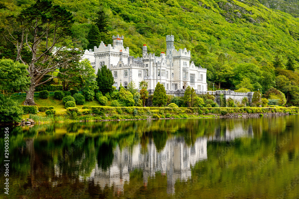 Kylemore Abbey with water reflections in Connemara, County Galway, Ireland, Europe. Benedictine monastery founded 1920 on the grounds of Kylemore Castle. Mainistir na Coille Moire Kylemore Abbey with water reflections in Connemara, County Galway, Ireland, Europe. Benedictine monastery founded 1920 on the grounds of Kylemore Castle. Mainistir na Coille Moire