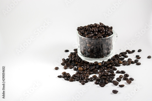 coffee beans in a cup isolated on white