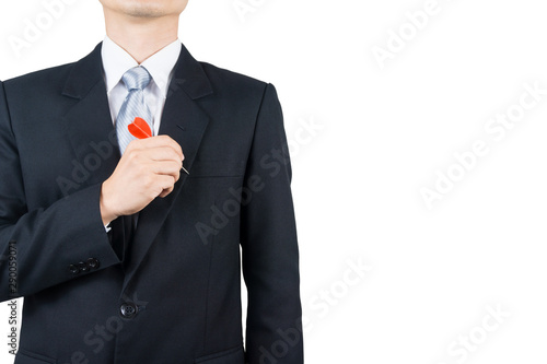 Businessman holding a dart