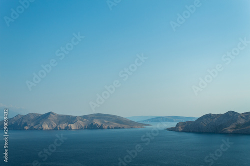 Seascape: rocky islands, turquoise water, bright blue sky. Natural natural gradient of blue tones. Baska, island of Krk, Croatia. © Olga