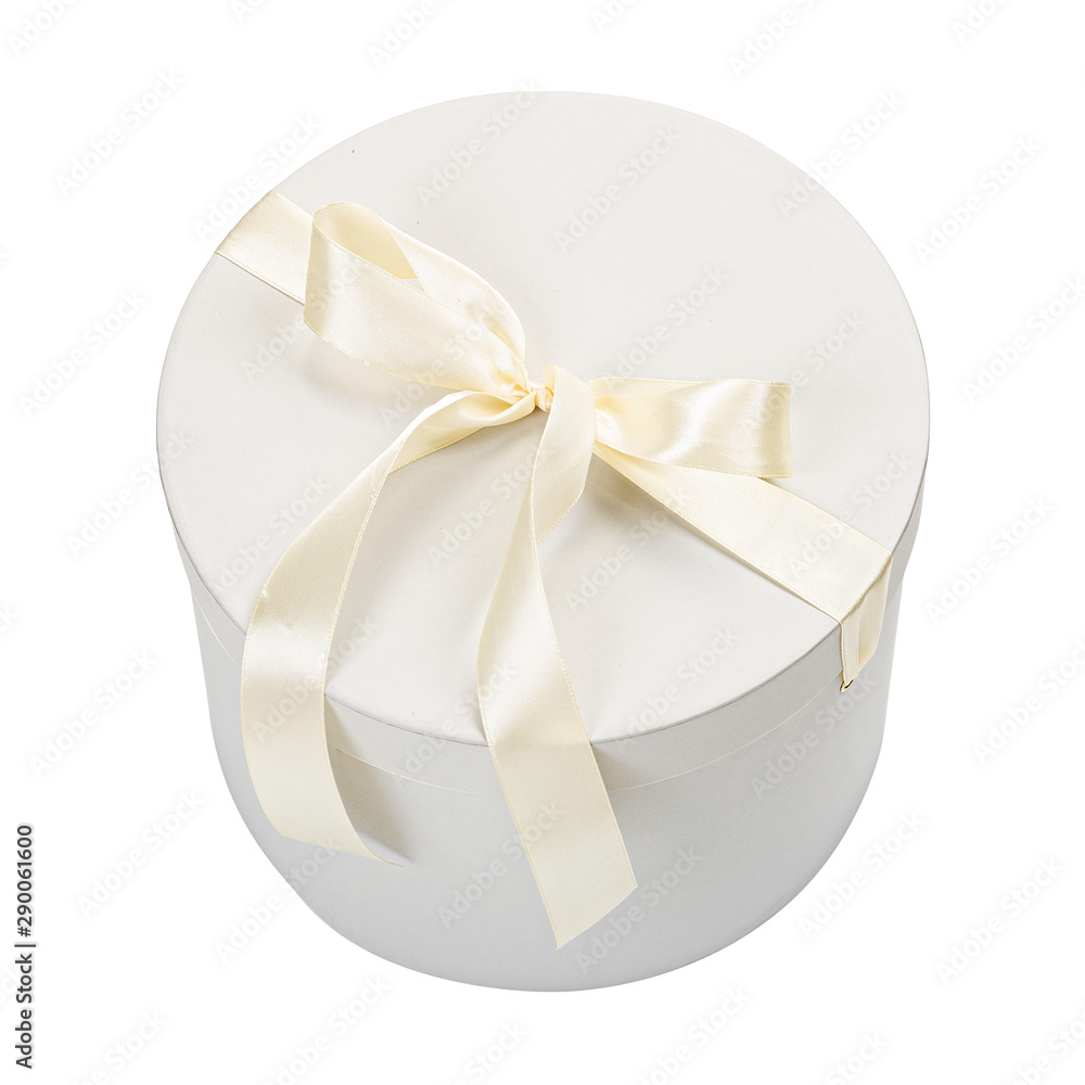 White round cartoon gift box with cream color bow isolated on white background White round cartoon gift box with cream color bow isolated on white background