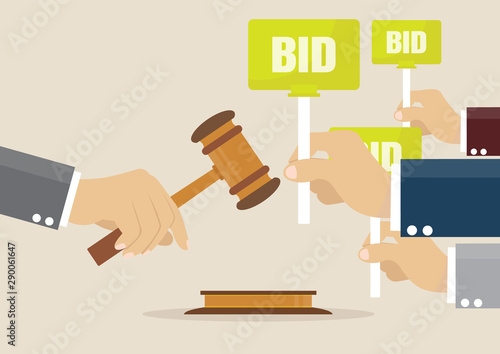 Hand holding auction paddle.