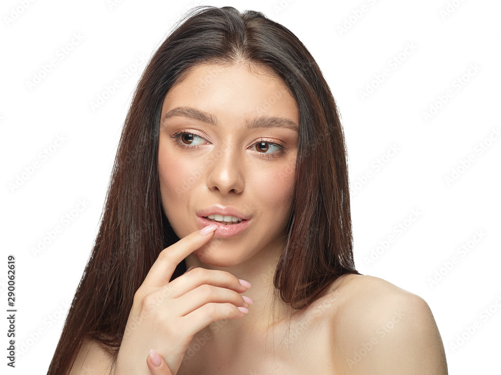 Portrait of beautiful young woman isolated on white studio background. Caucasian healthy female model looking at side, serious. Concept of women's health and beauty, self-care, body and skin care. Portrait of beautiful young woman isolated on white studio background. Caucasian healthy female model looking at side, serious. Concept of women's health and beauty, self-care, body and skin care.