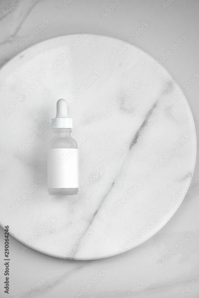 Fototapeta premium Bottle of whey on white marble