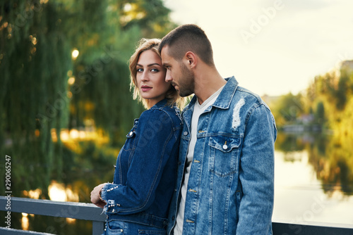 Young beautiful loving couple posing on nature