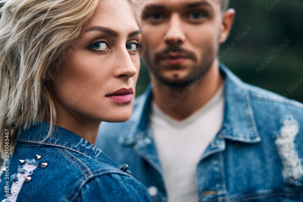 Closeup portrait of beautiful couple wear denim jeans Closeup portrait of beautiful couple wear denim jeans