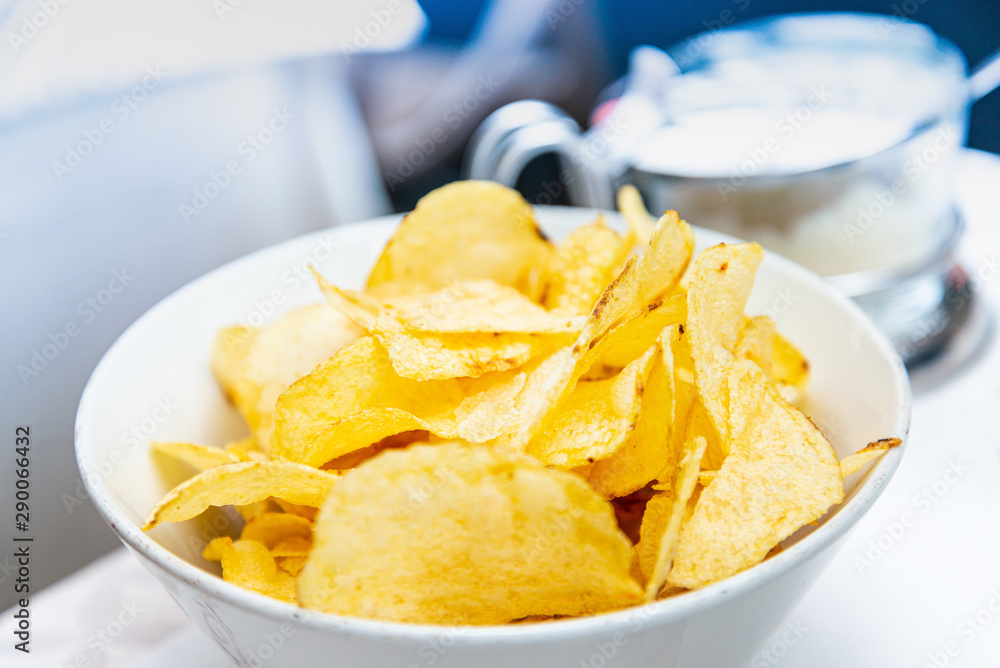 Chips in basket - Mexican chips in a basket on table Chips in basket - Mexican chips in a basket on table