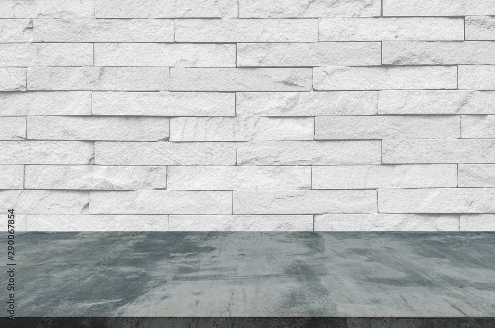 white brick wall and wooden floor