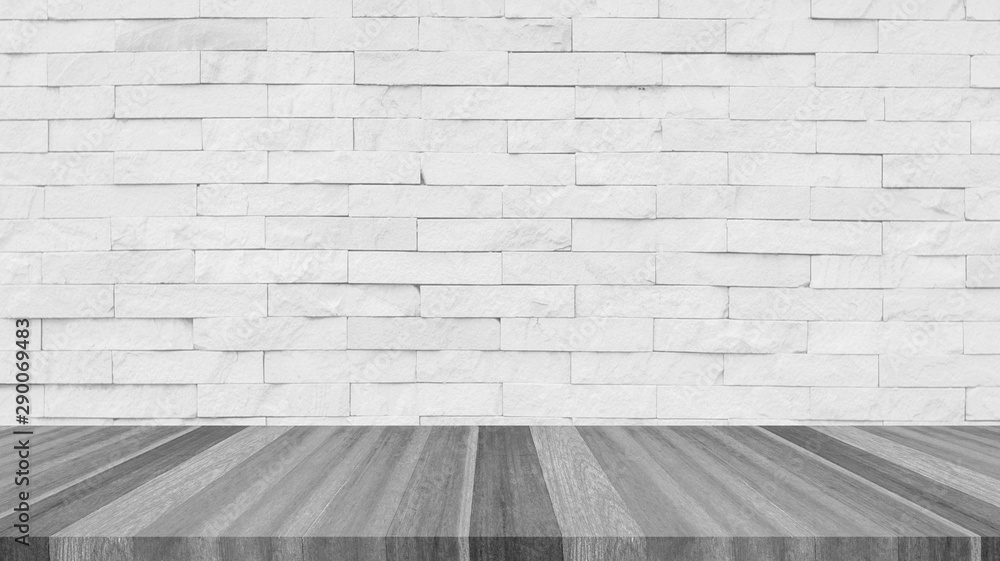 white brick wall and wooden floor