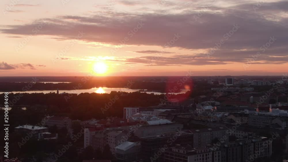 Sun. Flying over the city center of Helsinki during sunset. Finland golden sky. Downtown aerial drone shot. Sun. Flying over the city center of Helsinki during sunset. Finland golden sky. Downtown aerial drone shot.