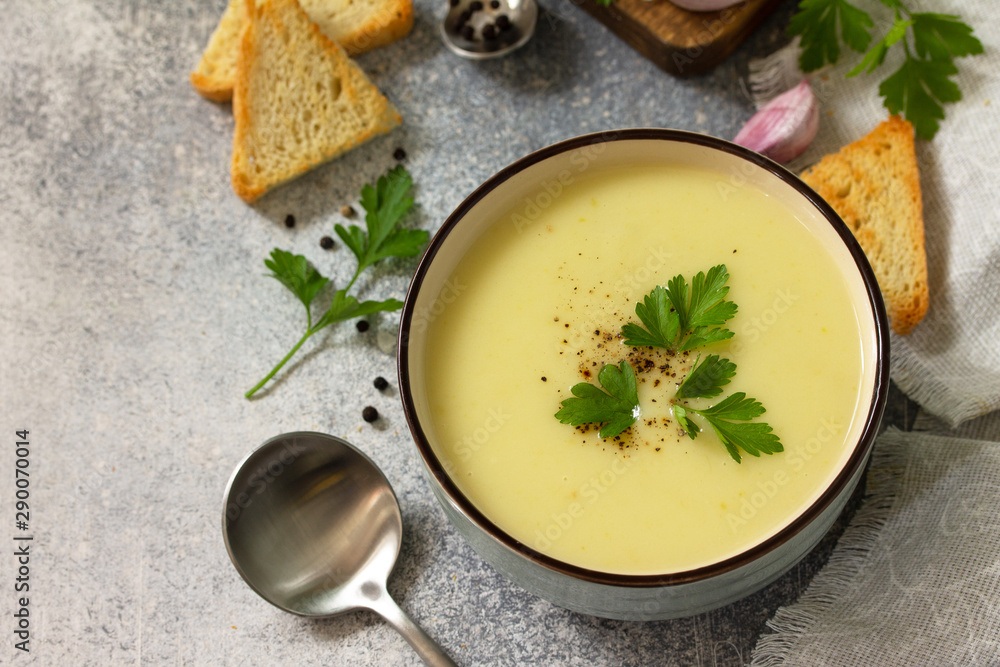 Vegetarian dish. Dietary Tasty Summer cream soup Zucchini on a light background. Free space for your text. Vegetarian dish. Dietary Tasty Summer cream soup Zucchini on a light background. Free space for your text.