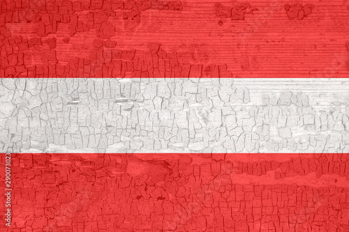 Austria flag on an old painted tattered wooden surface.