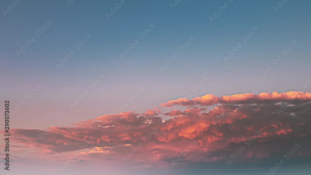 Sunset Sky. Bright Dramatic Sky With Fluffy Clouds. Yellow, Orange, Blue And Magenta Colours Sunset Sky. Bright Dramatic Sky With Fluffy Clouds. Yellow, Orange, Blue And Magenta Colours