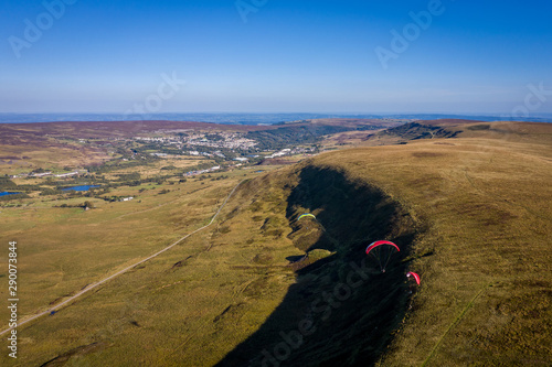 Aerial view above Single Paragliders in Brecon Beacons Wales, Paragliding off the Blaenavon Mountains photo