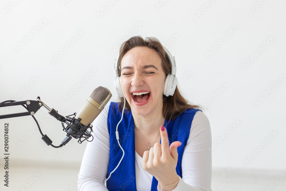 Radio, blogging, broadcast concept - woman dj is working on the radio Radio, blogging, broadcast concept - woman dj is working on the radio
