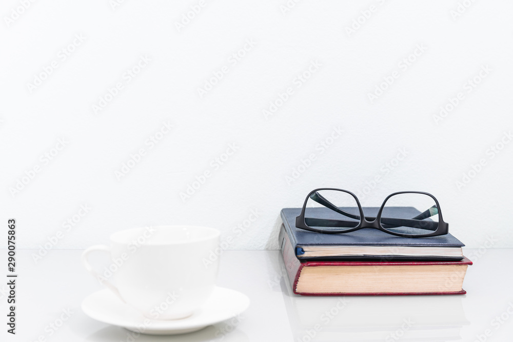 Coffee cup and old books