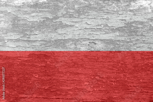 Poland flag on an old painted wooden surface.