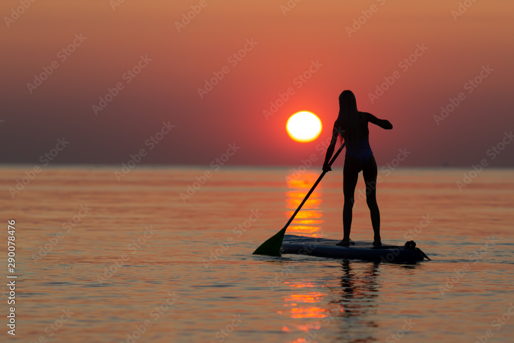 Rise and Glide: Morning Paddleboard Silhouette