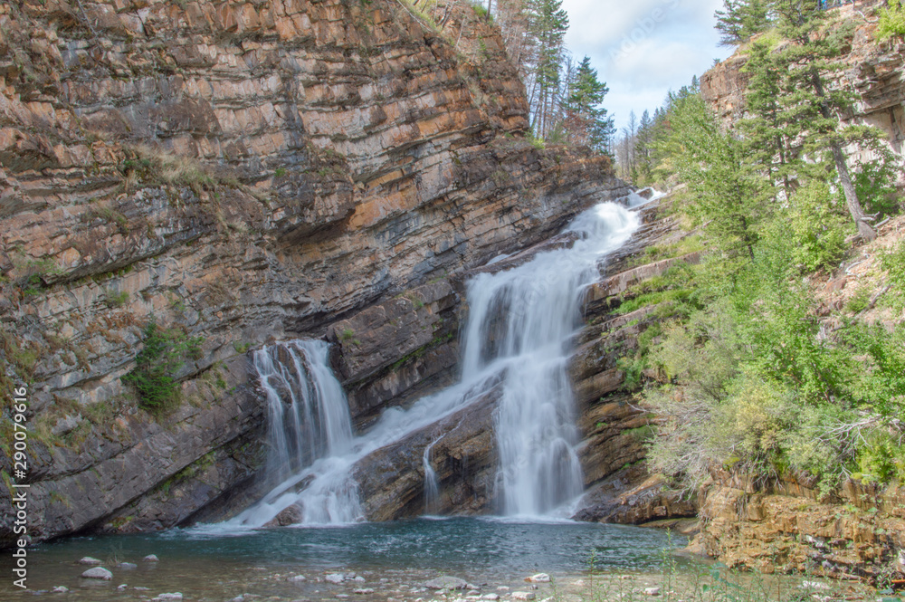 Beautiful waterfall with a long exposure located in Waterton, Alberta.