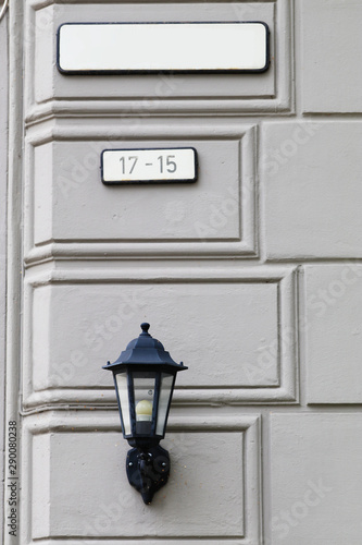 Canvas Print Street lamp and sign on wall