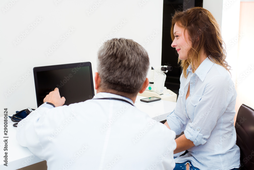 The doctor and his patient discuss further treatment The doctor and his patient discuss further treatment