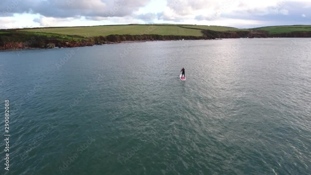 Man doing sport, paddle board, at seaside, aerial view Man doing sport, paddle board, at seaside, aerial view