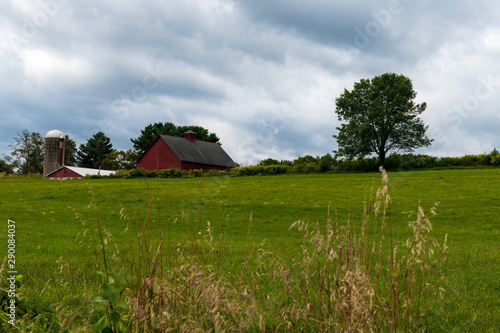 A photograph of a barn and land on a working farm that was deeded to a town for open space