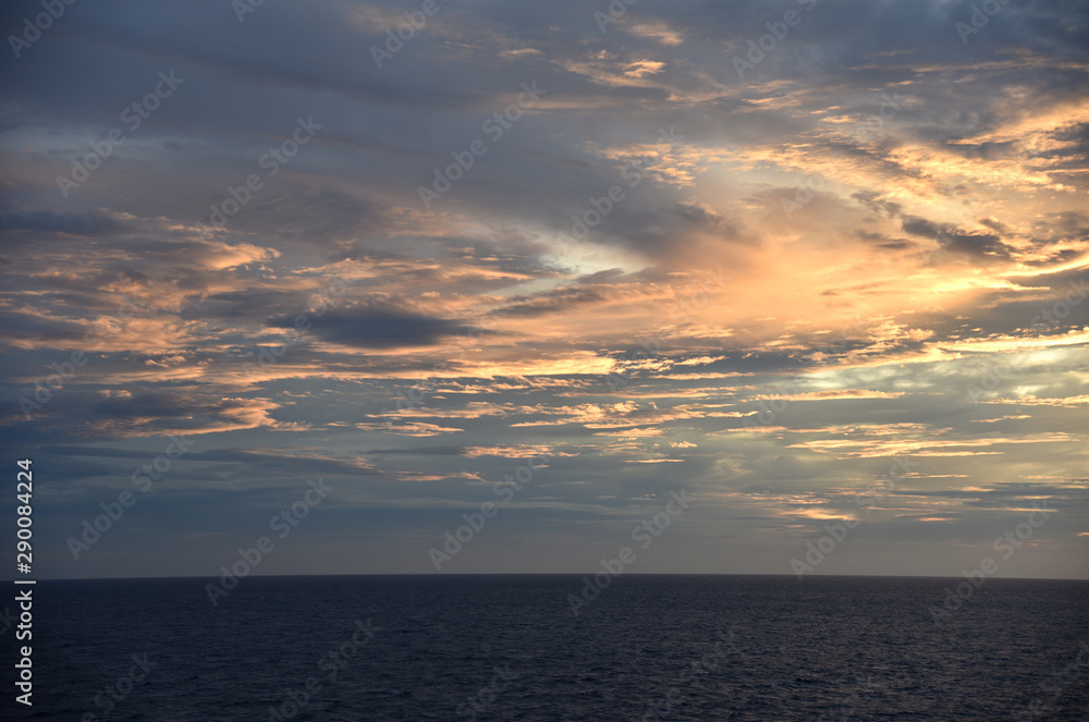 Fototapeta premium Sunset over the sea, view from the sailing ship.