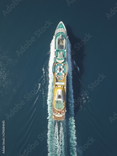 Aerial view large cruise ship at sea, Passenger cruise ship vessel, sailing across the Ksamil, Albania. View from drone. photo