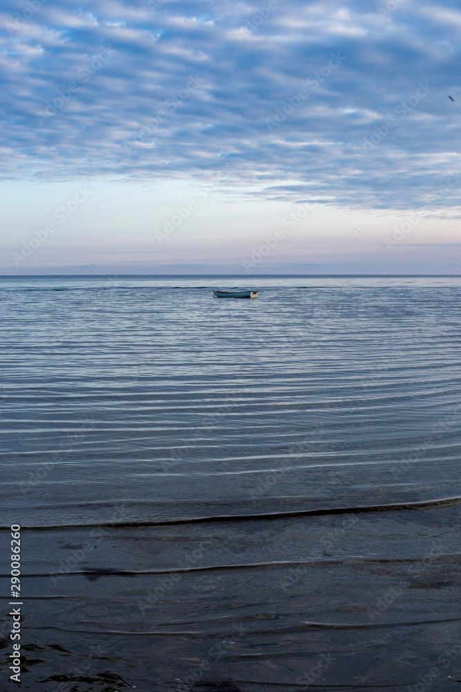 boat at the sea on a cloudy day