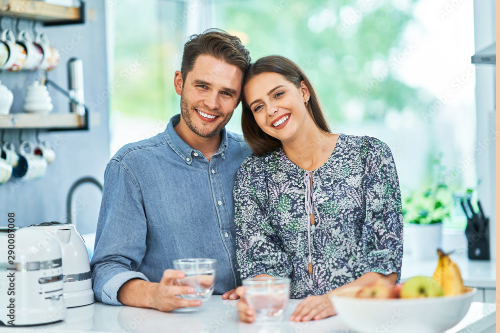 Young couple spending time in the kitchen Young couple spending time in the kitchen