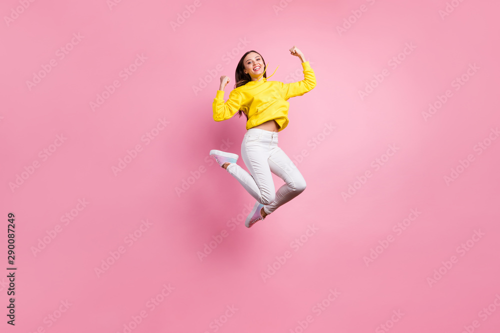 Full length body size photo of charming cheerful cute attractive girl having won some competitions while wearing yellow sweater footwear isolated over pink pastel background